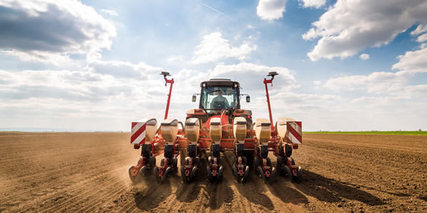 Tractor pulling a corn planter in a Grower Notes managed farm